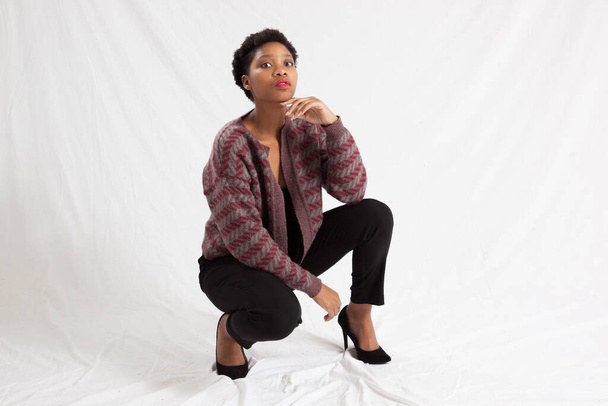 Pretty Black woman squatting - Valokuva, kuva