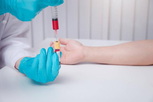 Doctor or Medical staff collect blood samples from patients infected with the coronavirus or COVID-19. for examination in the lab. Pandemic Coronavirus, COVID-19. - Photo, Image