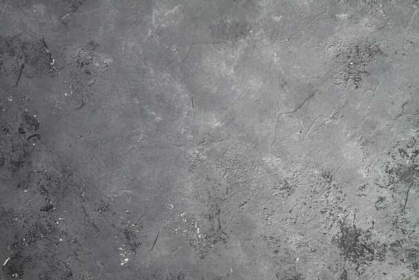 retro steen Betonnen donkergrijze achtergrond met oude verouderde rotswanden en zwarte spatten. Grungy verf Gestructureerde vloer of muur cement textuur in de grunge stijl. Ruimte voor tekst - Foto, afbeelding
