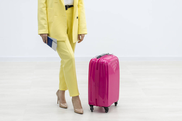 Cropped shot of young female traveler with two suitcases ready to explore new destination. - Foto, Imagem