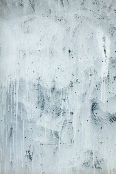 White paint strokes on a window  - Фото, изображение