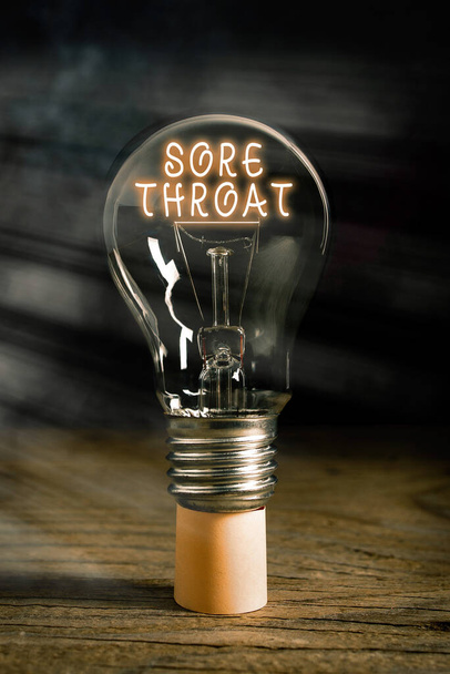 Word writing text Sore Throat. Business concept for Inflammation ot the pharynx and fauces resulted from an irritation Realistic colored vintage light bulbs, idea sign solution thinking concept. - Photo, Image