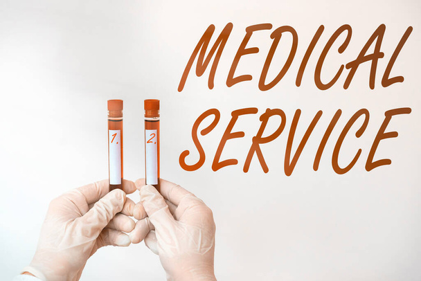 Text sign showing Medical Service. Conceptual photo care and treatment provided by a licensed medical provider Extracted blood sample vial ready for medical diagnostic examination. - Photo, Image