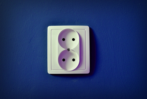 Alone outlet on wall background - Foto, Imagen
