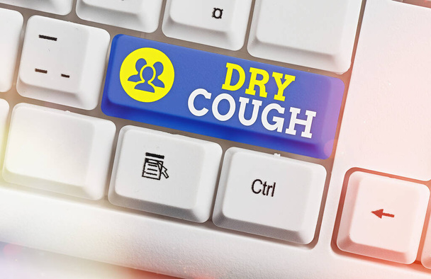 Text sign showing Dry Cough. Conceptual photo cough that are not accompanied by phlegm production or mucus White pc keyboard with empty note paper above white key copy space. - Photo, Image