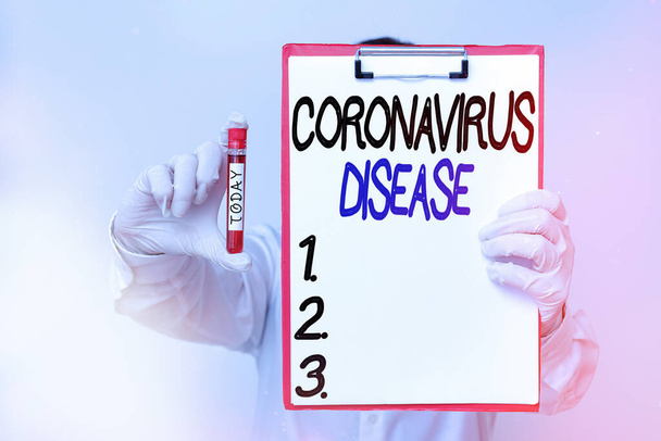 コロナウイルス病を示す概念的な手書き。新規ウイルスによる疾患と定義された業務用写真テキスト｜SARSCoV2臨床診断用血液検査サンプル. - 写真・画像