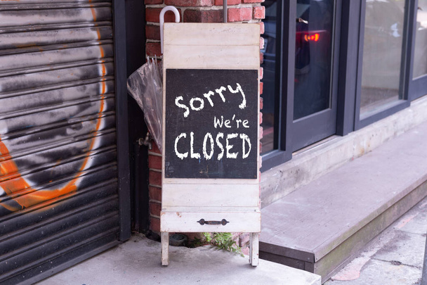sorry we are closed sign hanging outside a restaurant, store, office or other - Valokuva, kuva