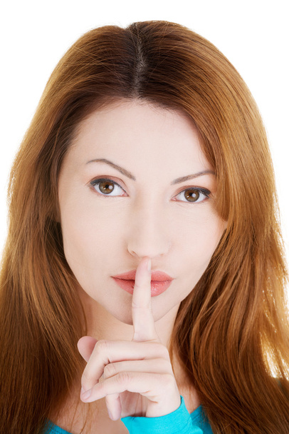 Woman with finger on her lips. - Photo, Image