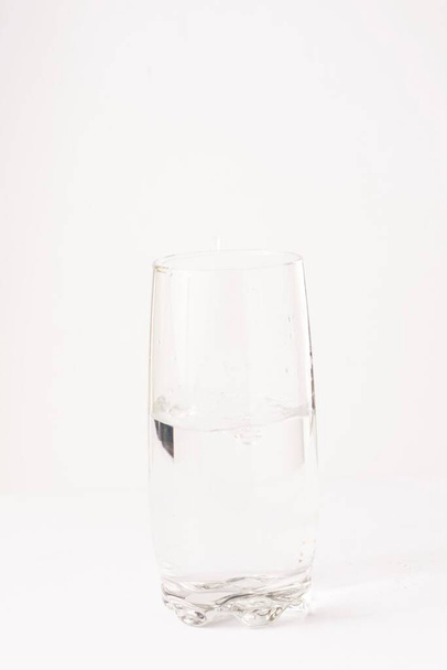 Glass half empty or glass half full. Psychology or motivational concept - 写真・画像