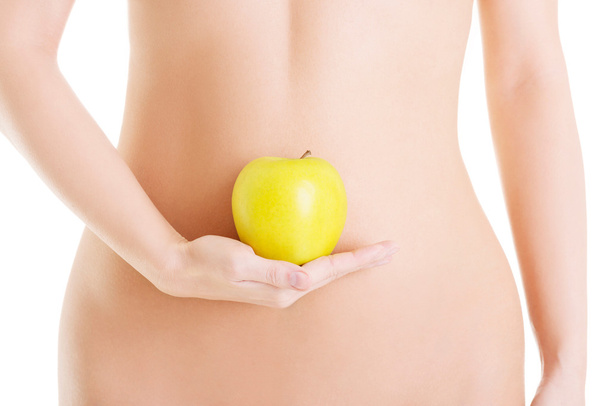 Beautiful female body and apple - Photo, Image