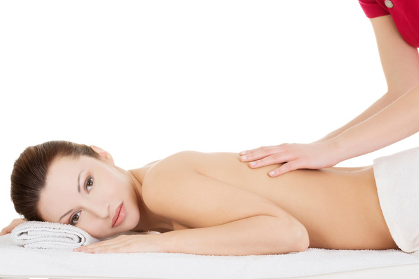 Preaty woman relaxing beeing massaged in spa - 写真・画像