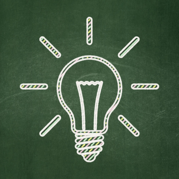 Finance concept: Light Bulb on chalkboard background - Fotografie, Obrázek