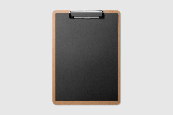 Real photo, wooden clipboard with blank black A4 paper mockup template, isolated on light grey background. High resolution. - Photo, Image