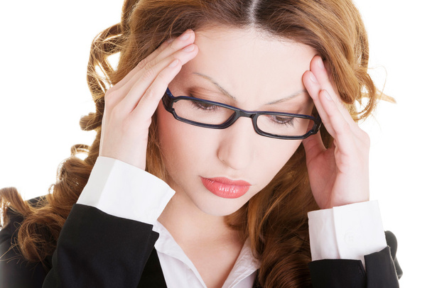 Businesswoman with a headache holding head - Photo, Image