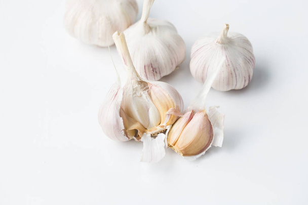 Garlic bulb- Garlic clove on the white background - Photo, Image
