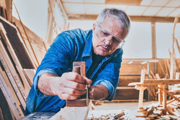 Carpenter At Work Using Jointer Plane - Photo, Image