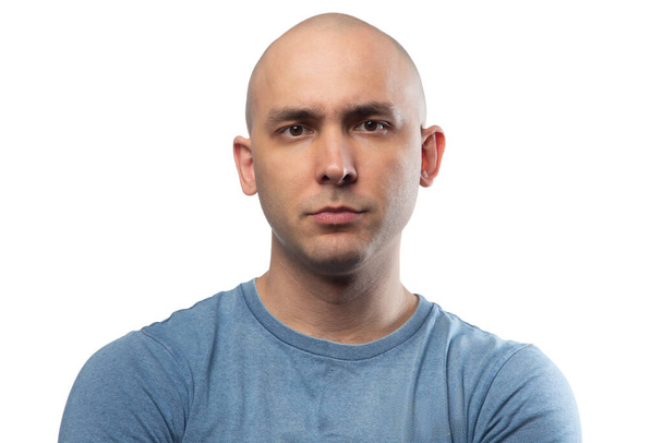 Photo of young bald confused man in blue tee shirt - Fotografie, Obrázek