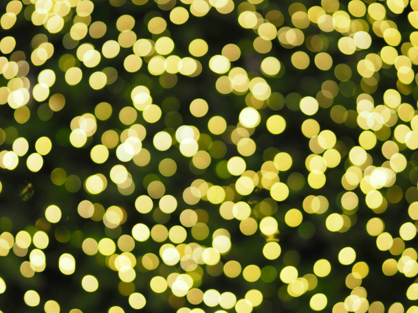 bokeh de tiro luzes de tênis de mesa iluminação colorida, cor amarela borrada de fundo dia de Natal
 - Foto, Imagem