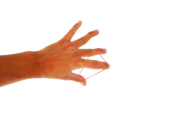 Műanyag gumiszalag kéz a kézben, ujjgyakorlat fehér alapon - Fotó, kép