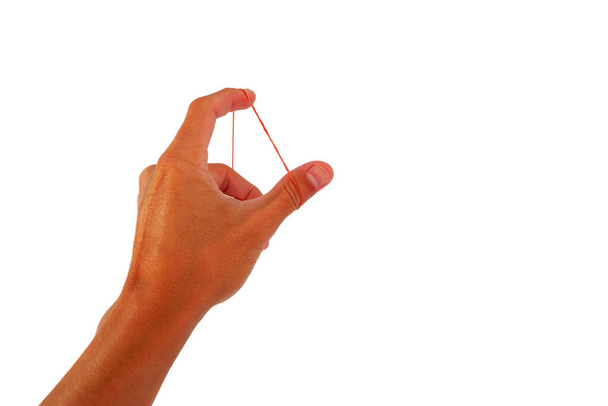 Plastic rubber band in hand with finger exercise on white background - Photo, Image
