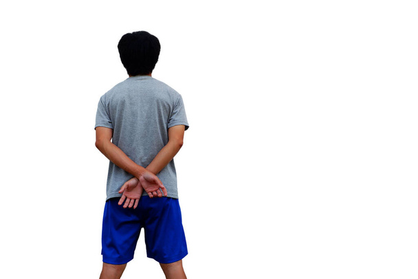 Homem está de pé em um gesto de mãos cruz por trás é relaxar gesto Em uma posição confortável isolado no fundo branco
. - Foto, Imagem