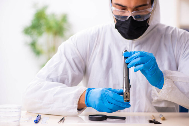 Male expert criminologist working in the lab for evidence - Photo, Image