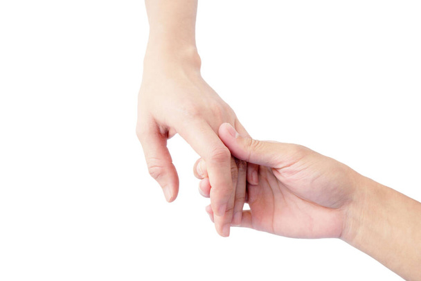 mano del hombre y la mujer se toman de la mano para mostrar el amor aislado sobre fondo blanco
 - Foto, Imagen