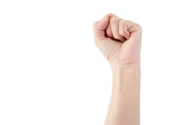 mano izquierda de la mujer asiática es mostrar el puño para arriba para la lucha media aislado en el fondo
 - Foto, imagen