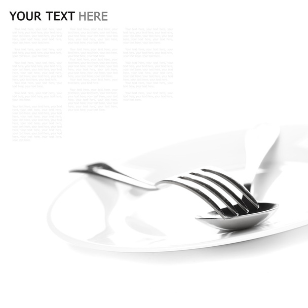 Close up of a silver spoon and fork on a white background (with - Foto, immagini