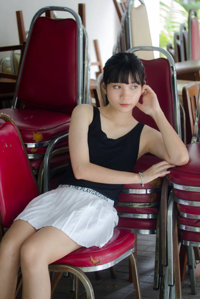 Portrait of thai adult beautiful girl black shirt white skirt relax time - Photo, Image