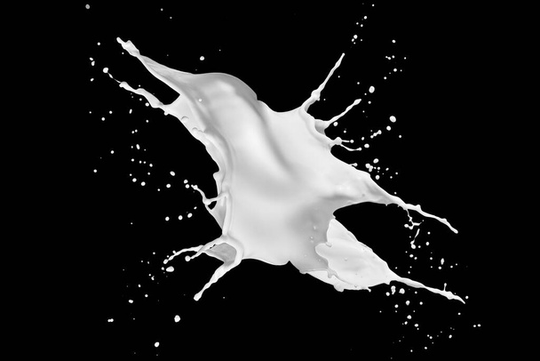 Photo of milk or white liquid splash with drops isolated on black background. Close up view - Zdjęcie, obraz
