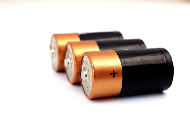 baterias de ouro em fileiras
 - Foto, Imagem