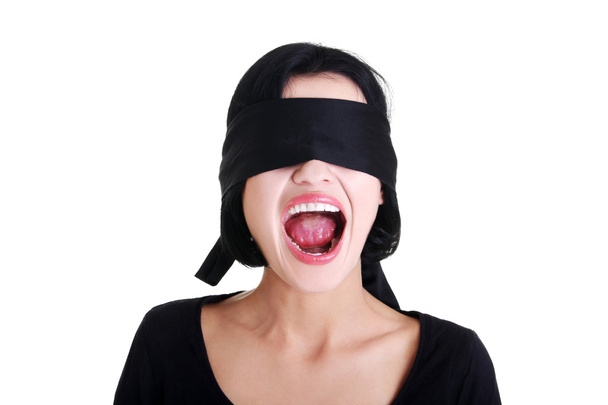Frighten young blindfold woman screaming - Фото, изображение