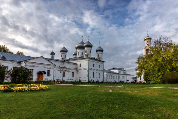 Panorama of the ancient male St. George Monastery in the suburbs of Veliky Novgorod. Autumn bright photo of the tourist places of Russia - Φωτογραφία, εικόνα