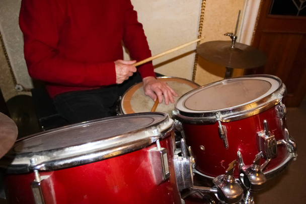 Senior man with drums. Rock, music, instrument entertainment concert concept - Zdjęcie, obraz