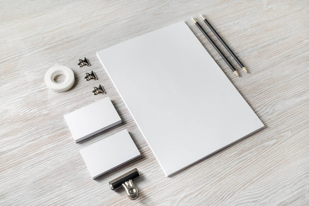 Photo of blank corporate identity. Stationery set. Branding mockup. Sheets of paper, letterhead, business cards, scotch tape and pencils. - Photo, Image