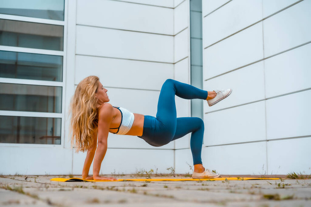 fit blonde woman doing yoga  - Фото, изображение