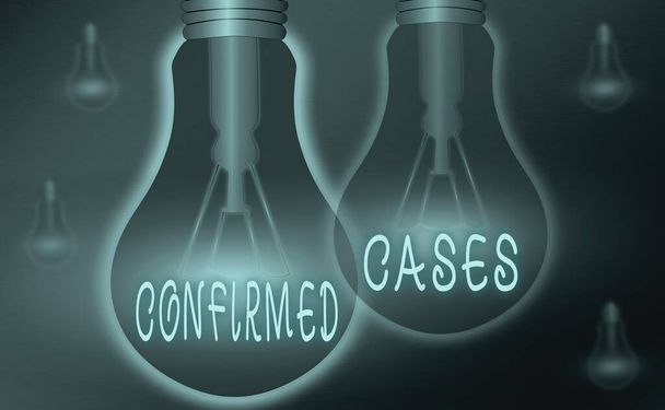 Text sign showing Confirmed Cases. Conceptual photo set of circumstances or conditions requiring action Realistic colored vintage light bulbs, idea sign solution thinking concept. - Photo, Image