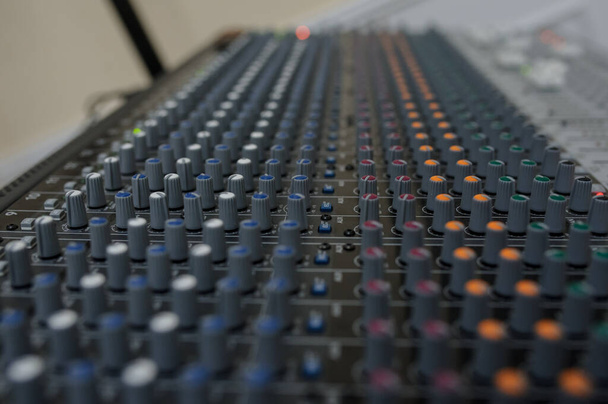 Close up photo of a mixing console of a DJ - Photo, Image