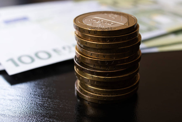 One hundred euro bills and coins close up - Fotografie, Obrázek
