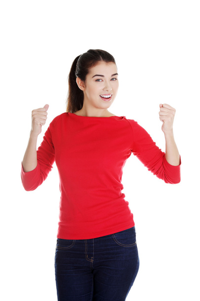 Excited young woman with fists up - Foto, immagini