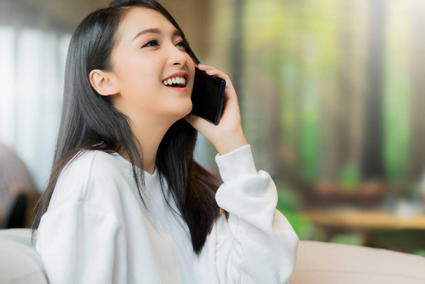 attractive smart beautiful asian female well dress communication smartphone with cheerful and confident blur public space background - Valokuva, kuva