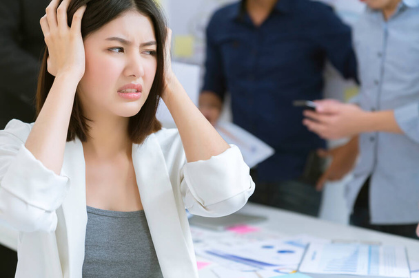 asian female office worker upset bore  hand touch head with troble and problem headache with unhappy result meeting with business colleague problem and stressful business discussion ideas concept - Photo, image