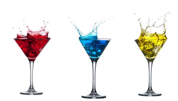 Red cocktail splashing into glass on white - Valokuva, kuva