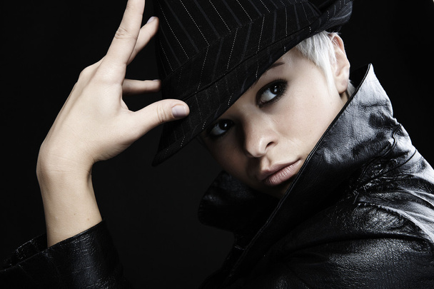 Portrait of attractive teenage girl in leather jacket & hat - Foto, imagen
