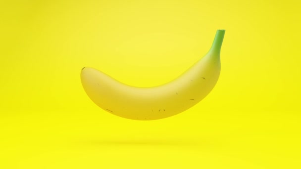 Animacja 3D - Banan pływający w pętli na żółtym tle - Materiał filmowy, wideo
