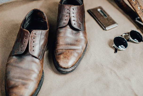 Brown leather accessories, shoes strap - Fotoğraf, Görsel