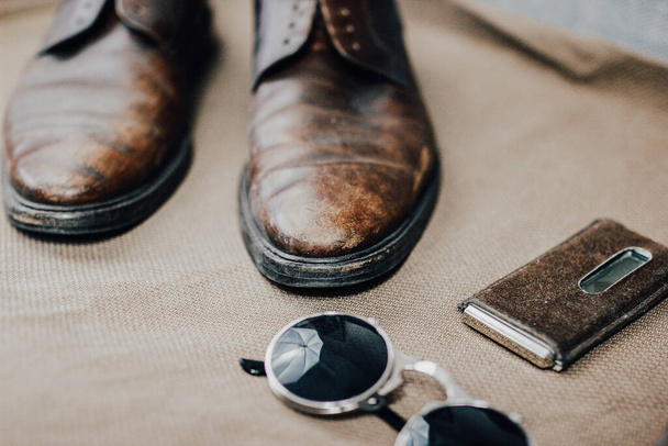 Brown leather accessories, shoes strap - Foto, Imagen