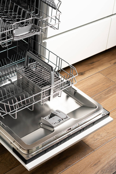 high angle view of open dishwasher with plates in modern kitchen - Φωτογραφία, εικόνα