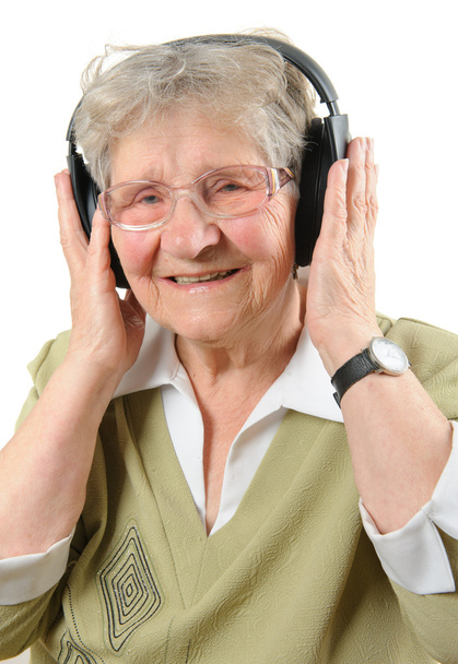 mujer mayor con auriculares
 - Foto, Imagen